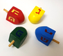 Package of Four Colorful Wood Dreidels with letters