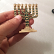 Miniature 7 Branch Menorah with Judaic Symbols, Dark Green and Gold - 2.7 Height