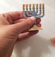 Miniature 7 Branch Menorah with Judaic Symbols, Blue on Gold - 2.7 Inches Height