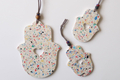 Graciela Noemi Handcrafted Terrazzo Hamsa, Cutout Heart - White and Colored Dots